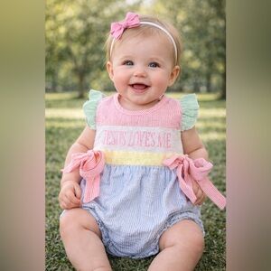 Pastel Striped Smocked and Embroidered Outfit adorned with bows. Size 12 to 18 m
